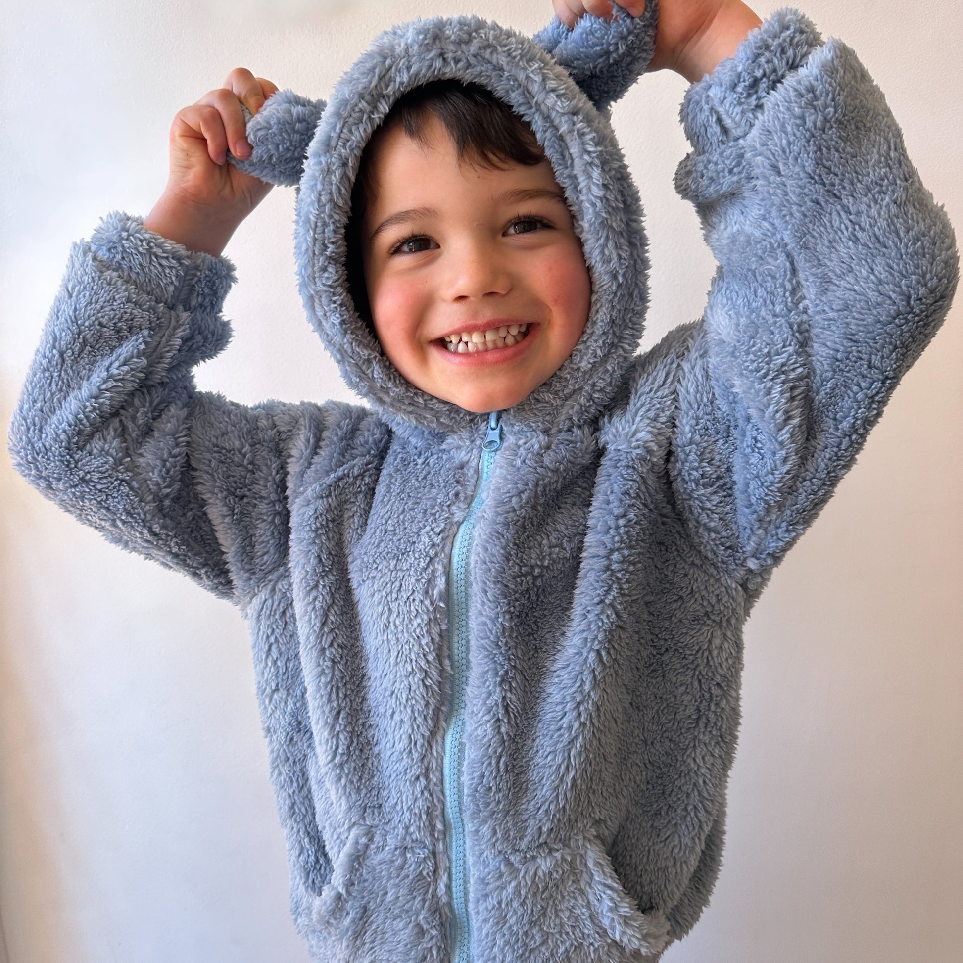 Maverick loves his cosy Cub Jacket in Sky Blue